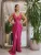 Rochie lunga fucsia conica cu slit pe mijlocul picioarelor si broderie pretioasa cu perle in partea superioara