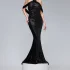 Rochie eleganta neagra accesorizata cu o floare pe un umar si franjuri negri